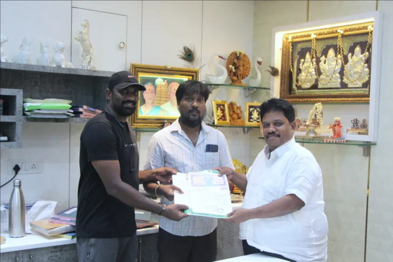 Property registration document handover between Anayaa Greenland team and happy plot buyers in office