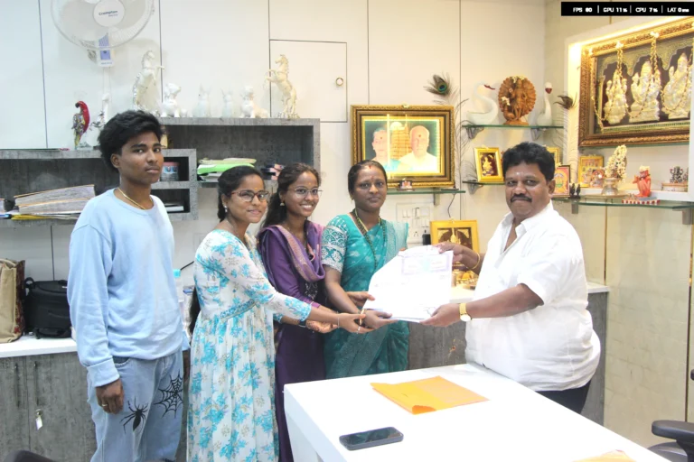 Property registration document handover between Anayaa Greenland team and happy plot buyers in office