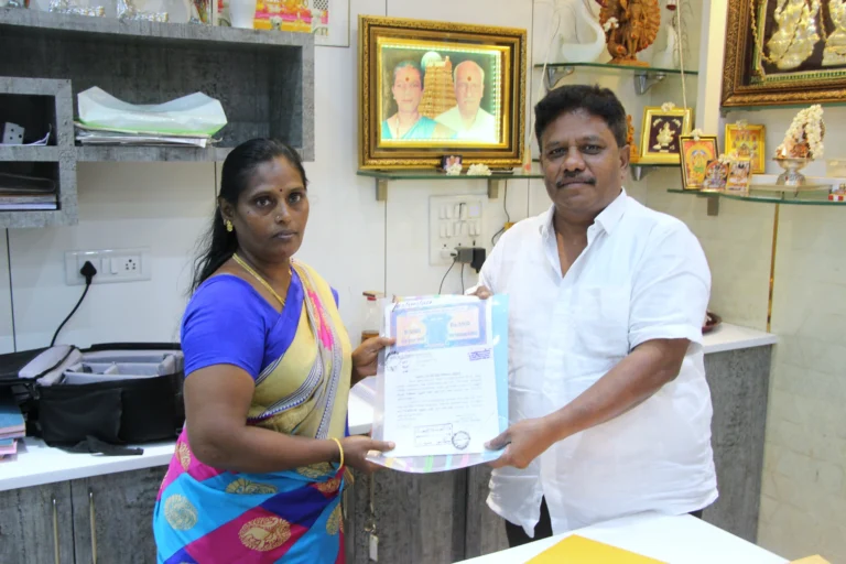 Property registration document handover between Anayaa Greenland team and happy plot buyers in office