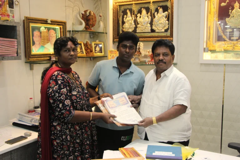 Property registration document handover between Anayaa Greenland team and happy plot buyers in office