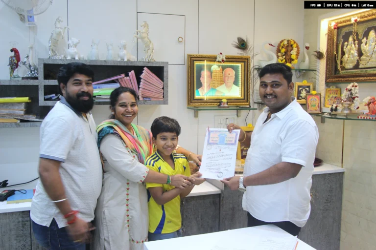 Property registration document handover between Anayaa Greenland team and happy plot buyers in office